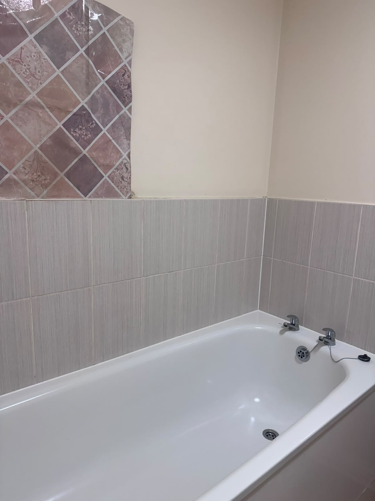 Cleaned bath and tiled surround ready for inspection