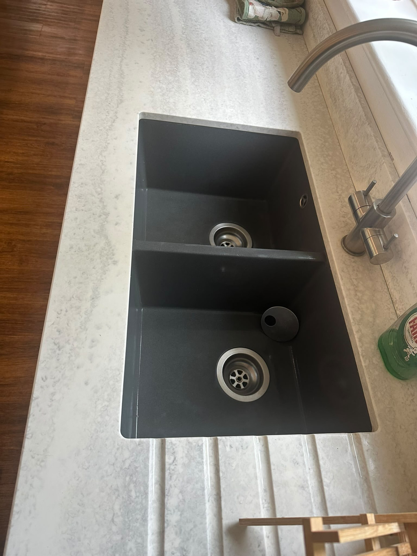 Spotless kitchen sink and worktop after cleaning