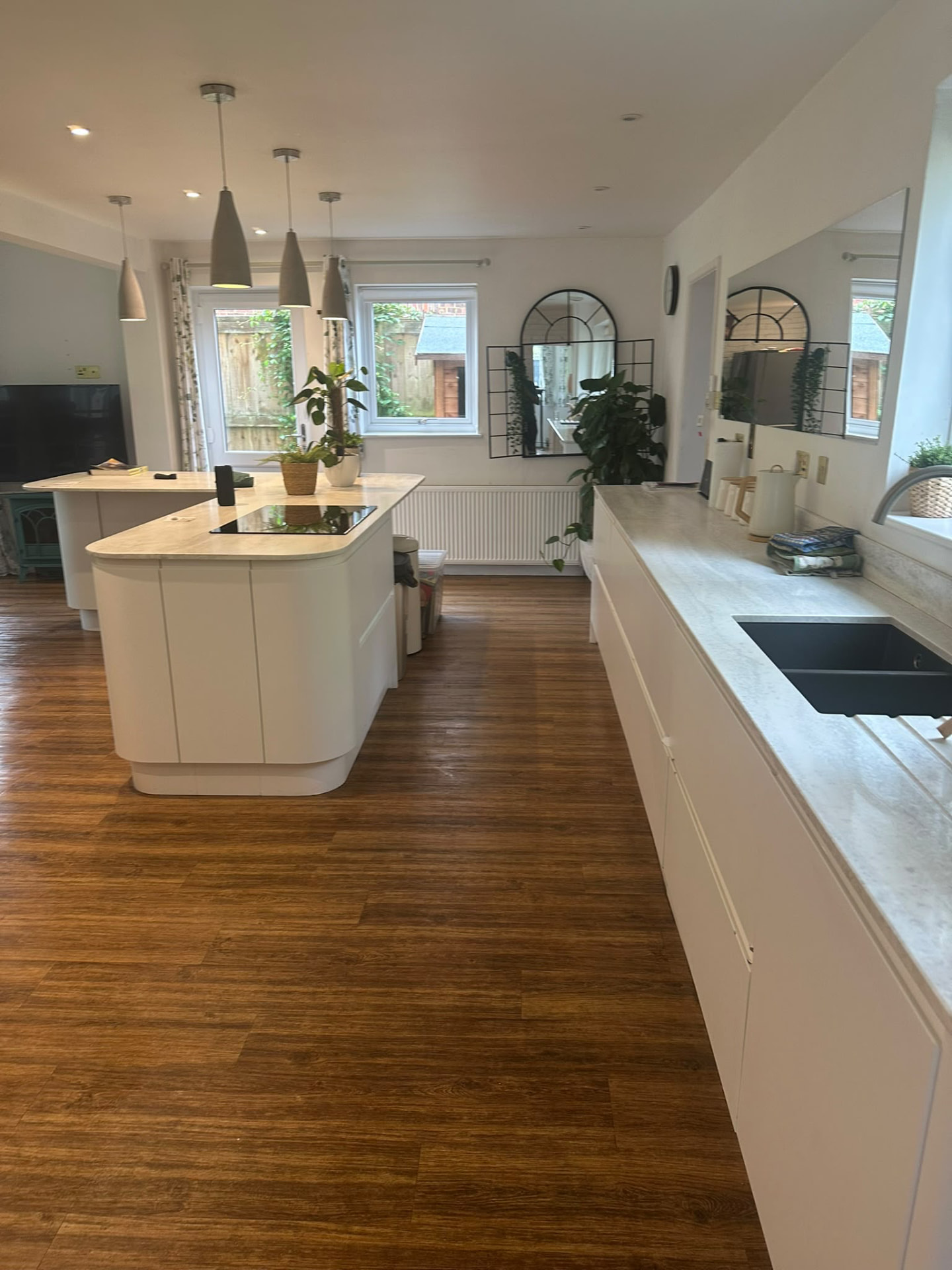 Cleaned open-plan kitchen with island and floors