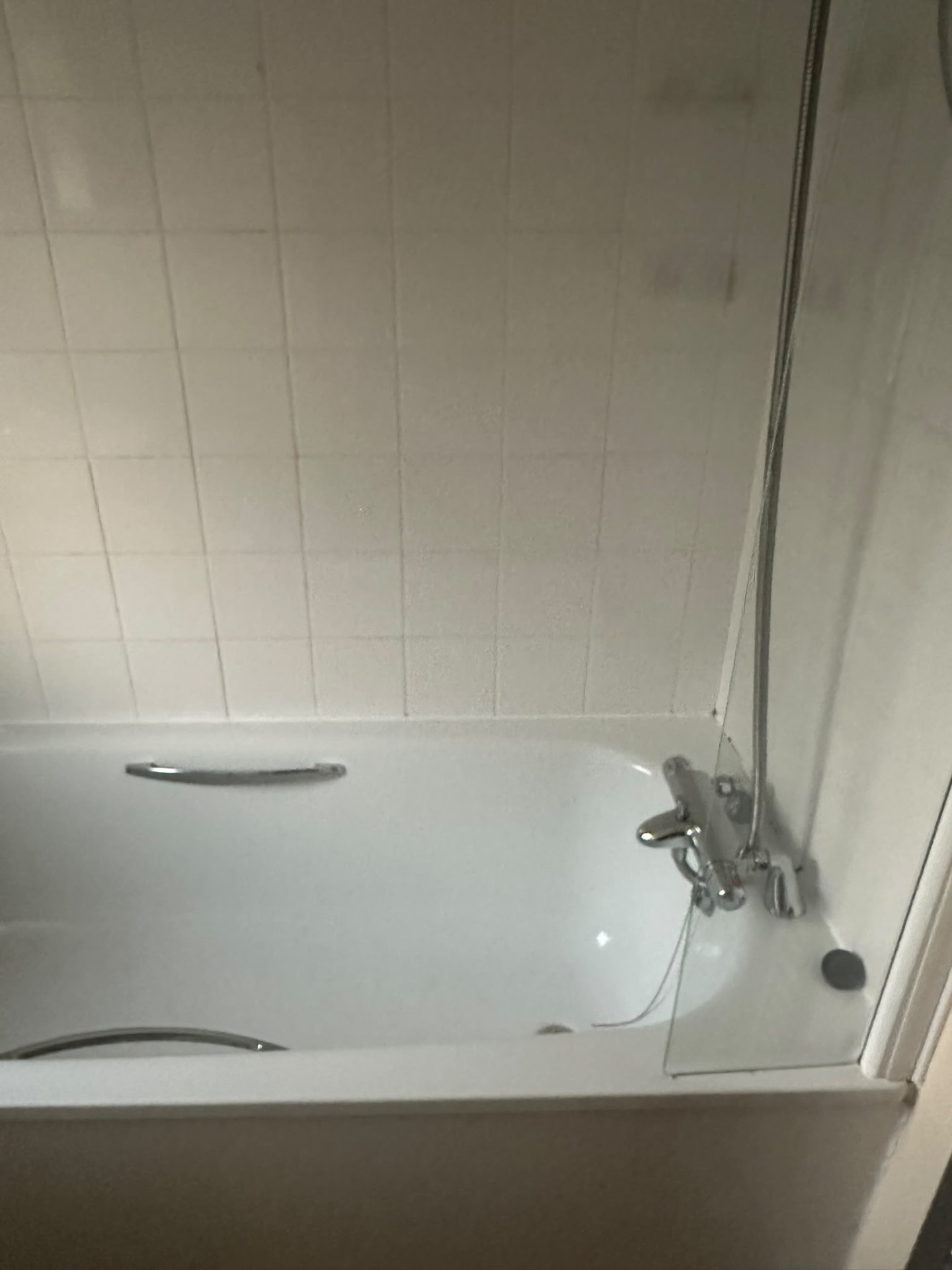 Cleaned bath and white tiling after an end-of-tenancy clean