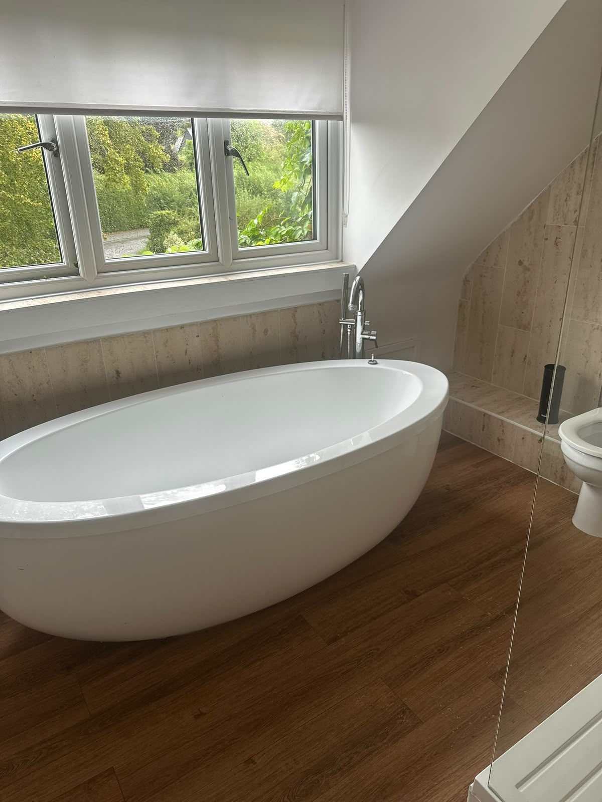 Deep-cleaned bathroom with freestanding bath and polished floor